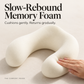 Close-up of a hand gently compressing the contoured slow-rebound memory foam core