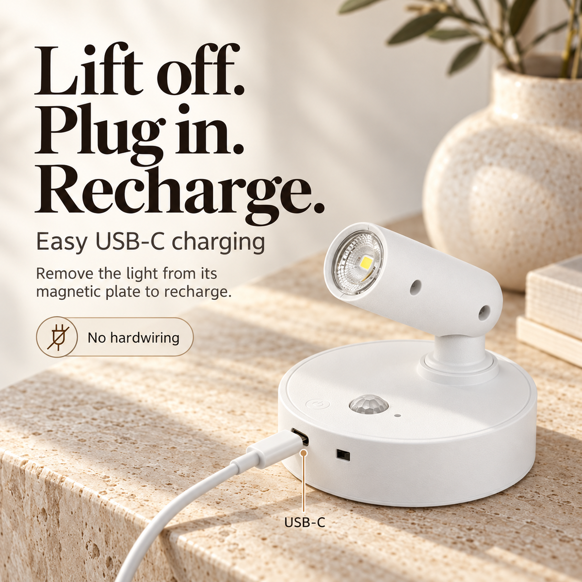 White rechargeable wall light with a USB-C cable connected to its base