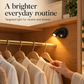 Black magnetic spotlight lighting clothing in an indoor wardrobe